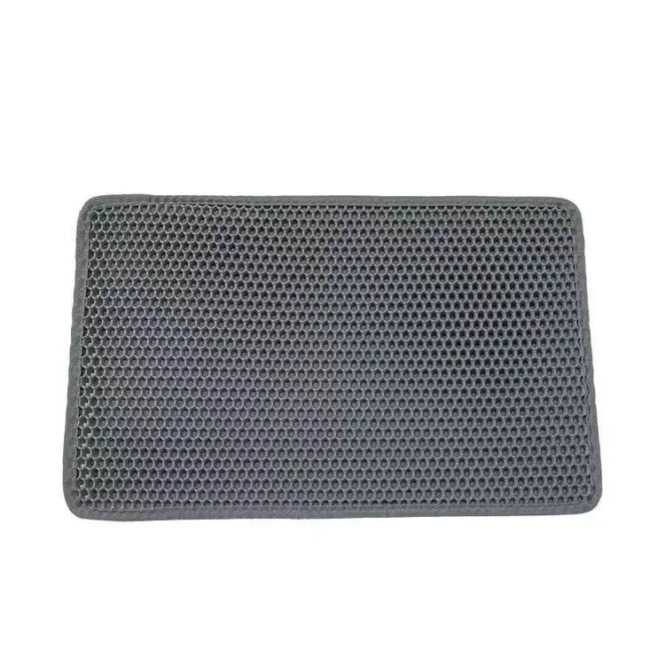Rectangular gray mat with honeycomb texture on a white background
