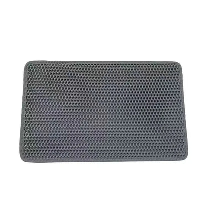 Rectangular gray mat with honeycomb texture on a white background