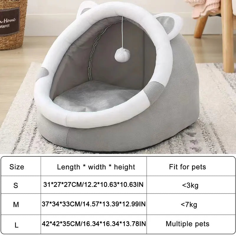 Gray pet bed with white accents on a carpeted floor, featuring a size chart at the bottom.